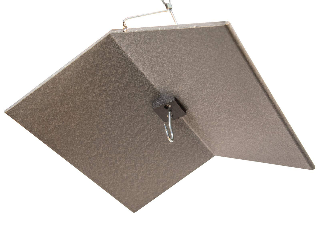 JCS Wildlife Large Poly Weather Cover hanging from a hook, protects bird feeders from rain and snow.