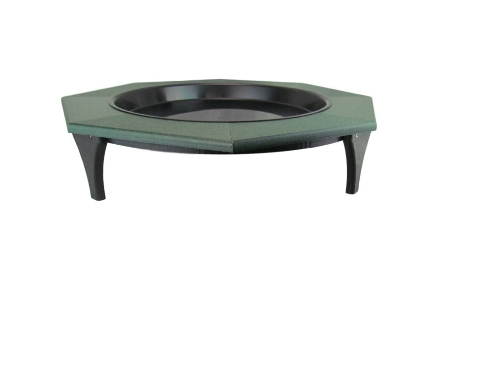 Plastic octagonal bird bath with dark green rim and black basin featuring curved legs and textured surface