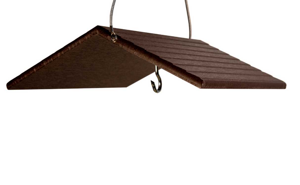 A dark brown wood hanging birdhouse roof detail showing grooved texture a small metal hook and wire hanging system