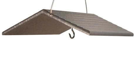 Close-up of a gray composite bird feeder roof with ribbed texture and a shiny metal hook hanging against a white background