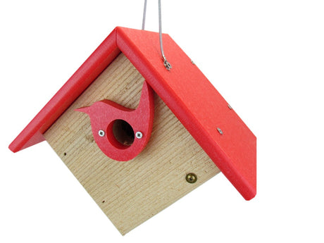 Wooden birdhouse with red roof and bird-shaped entrance hole featuring bright red accents and visible screws on a white background