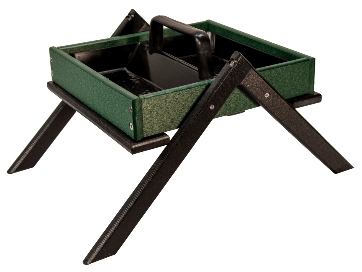 Product shot of a dark green and black recycled plastic bird feeder with a tray and carrying handle on an A-frame stand showing textured surfaces and visible screws