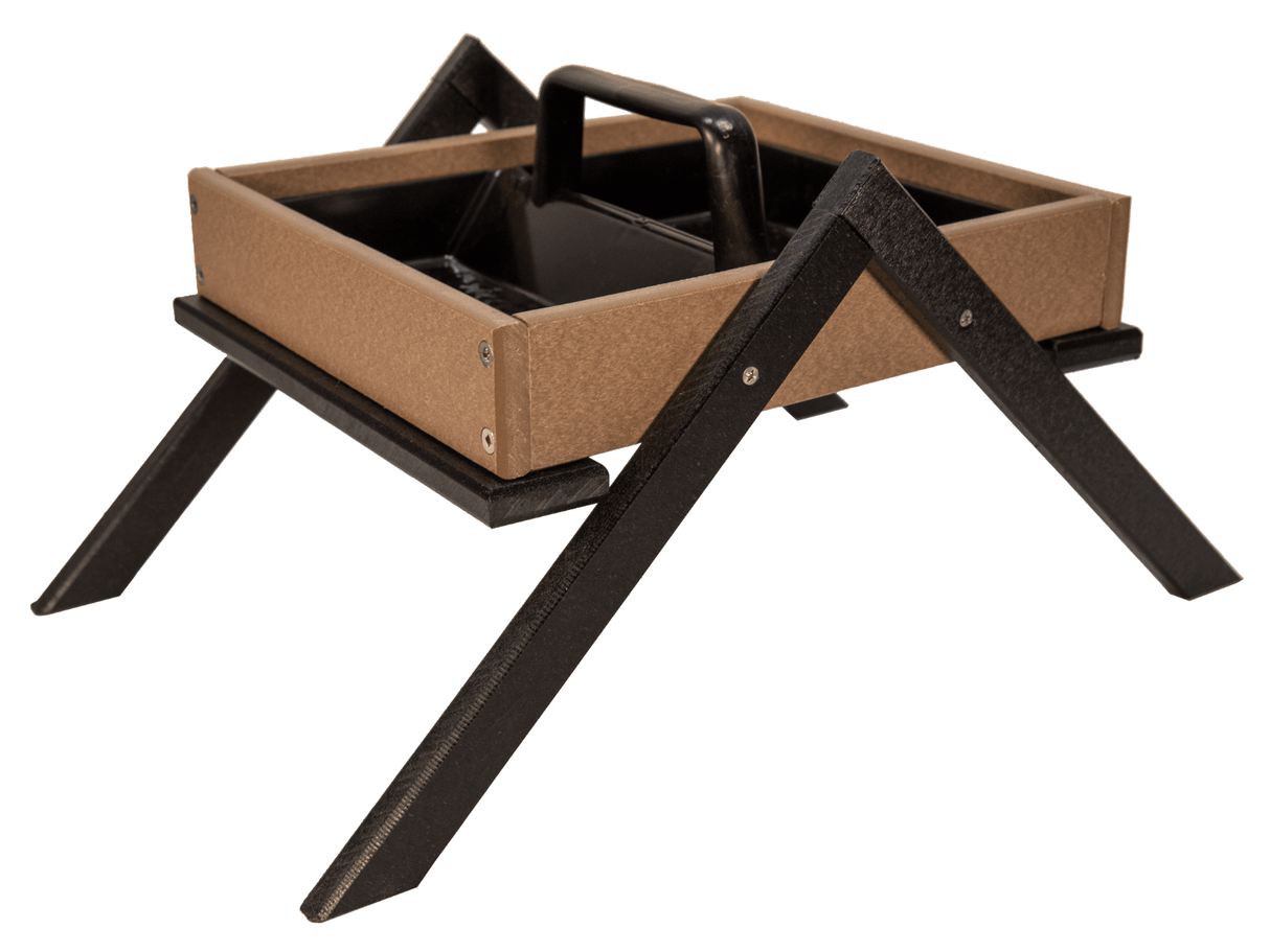 Recycled plastic bird feeder with tan tray black legs and a central handle showing visible screws and a textured surface