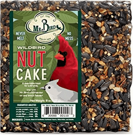 Mr. Bird illustration of a wildbird nut cake featuring a vibrant cardinal and tufted titmouse against a background of sunflower seeds, peanuts, and other colorful nuts