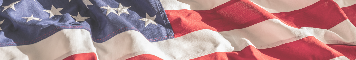 Close-up of the American flag, showcasing the stars and stripes in vibrant detail.