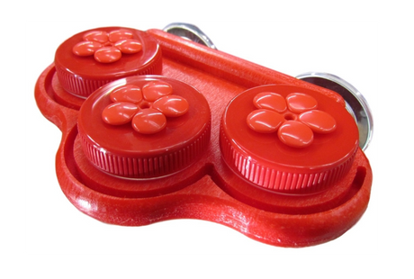 Plastic red double-container with flower-shaped lids and suction cups showcasing vibrant glossy finish and textured detailing