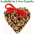 Heart-shaped birdseed cake adorned with a vibrant red ribbon featuring a mix of sunflower seeds pecans and millet