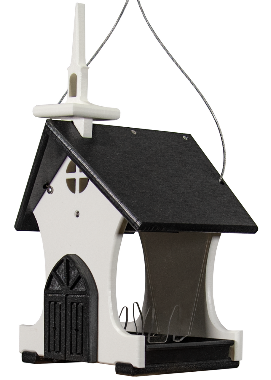 Plastic birdhouse feeder shaped like a church with a black roof, white steeple, and detailed black door featuring a cross window and perched on a gray cord.