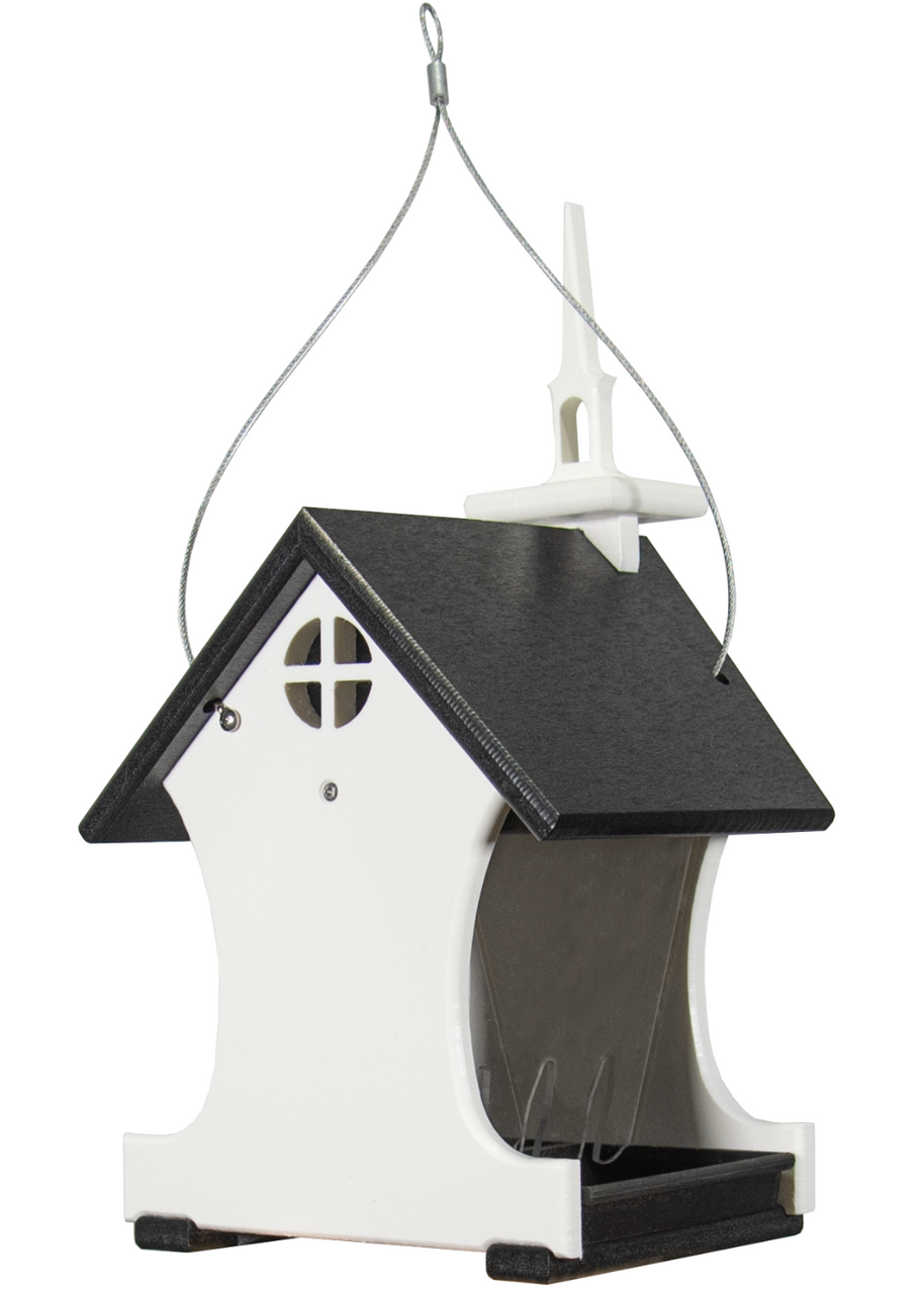 Plastic birdhouse feeder featuring a white church-style design with a dark gray roof a cross-shaped window and a small steeple hanging from a wire cable.