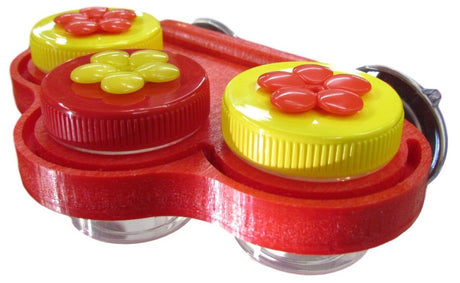 Plastic double hummingbird feeder with red and yellow flower accents and clear glass jars showing vibrant colors and textured lids