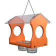 Recycled plastic orange bird feeder with clear acrylic roof hanging outdoors featuring two clear glass feeding cups and rounded openings