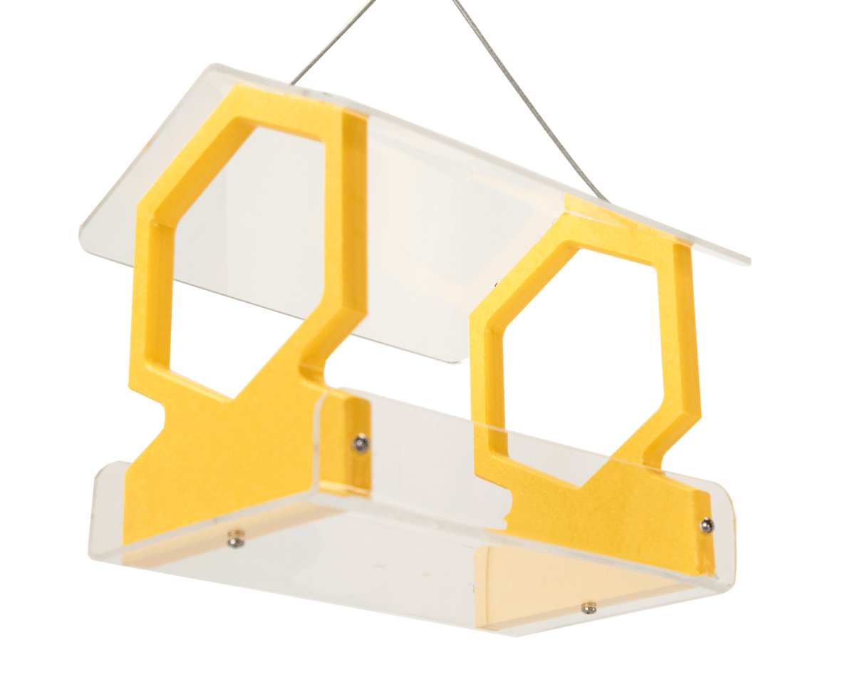 Acrylic and plastic bird feeder with yellow hexagonal accents hanging from a thin wire showcasing a modern design with clear panels and small metallic screws