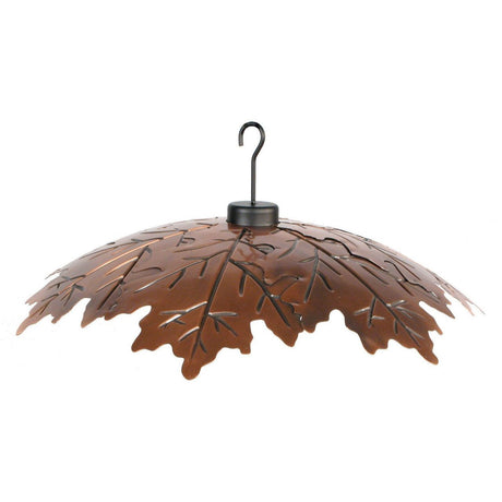 Metal leaf-shaped bird feeder with a black hook a dark brown copper finish and intricate leaf veins on a white background