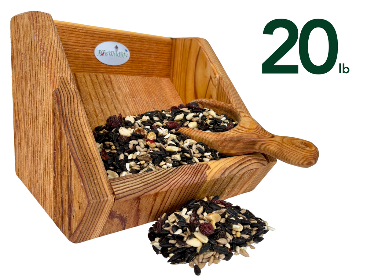 JQs Wildlife wooden bird feeder filled with 20 lbs of wild birdseed mix featuring sunflower seeds, peanuts, and dried cranberries in a rustic wooden scoop and container