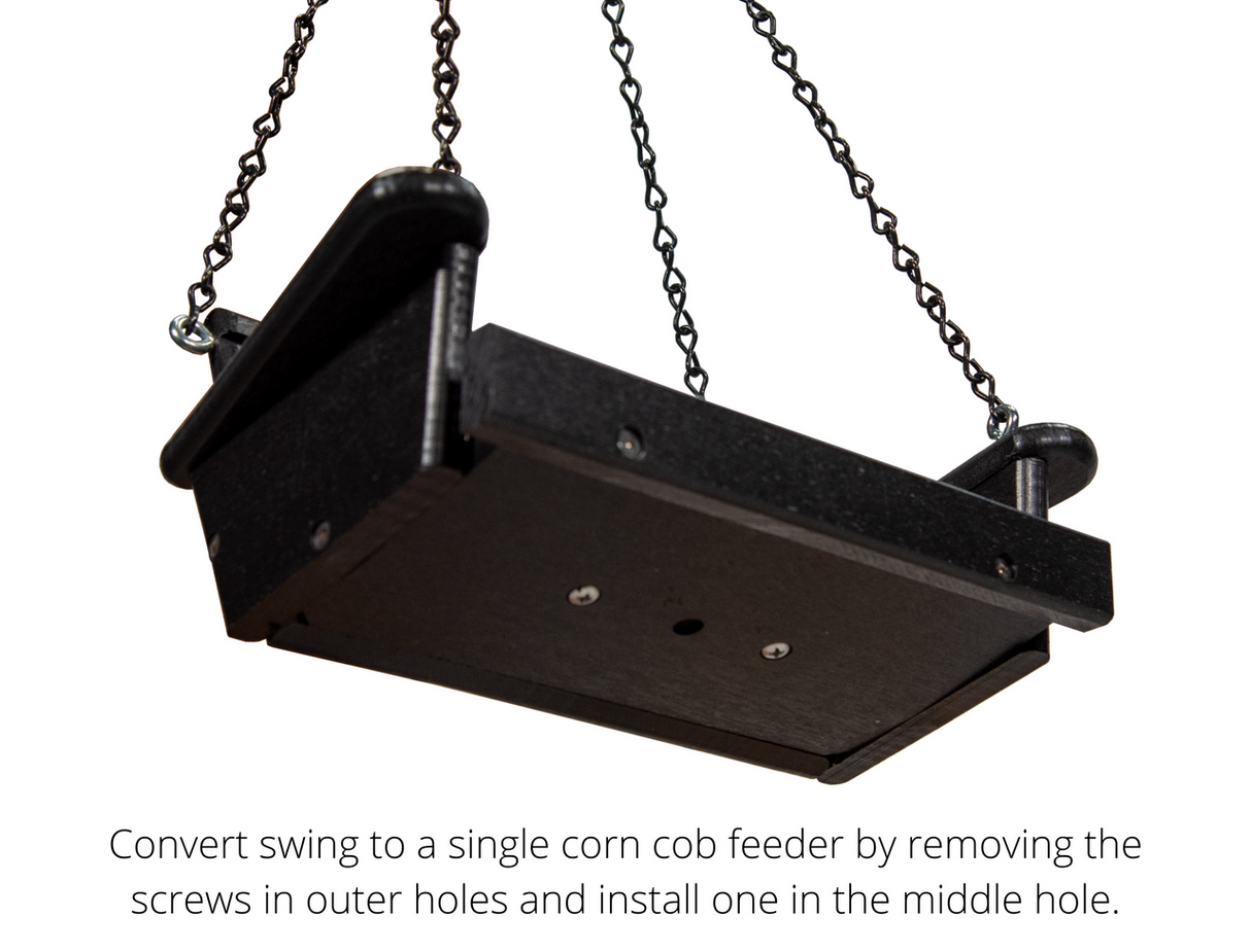 Product shot of a black plastic single corn cob feeder hanging from chains showing visible screws and a central hole.