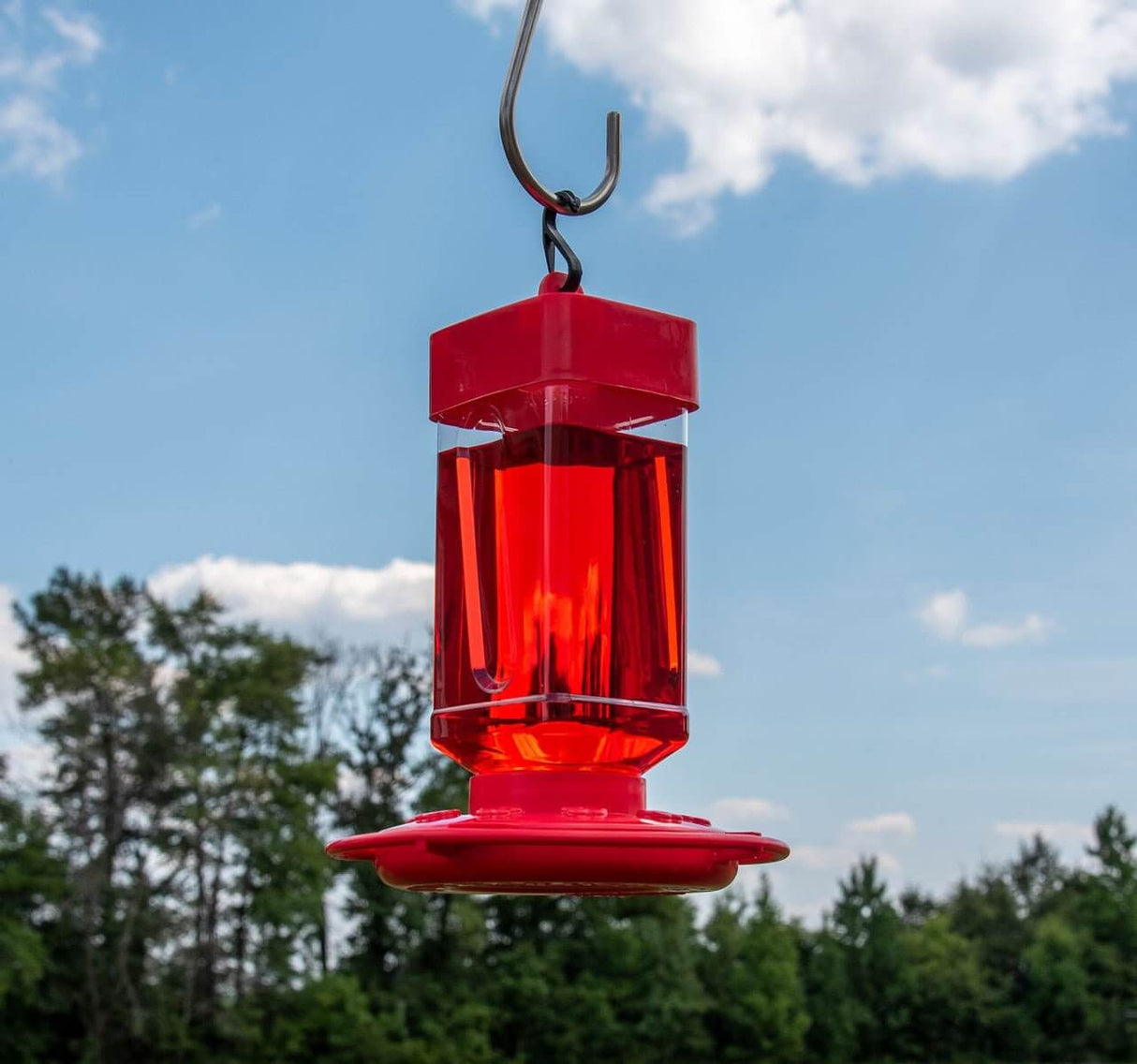 First Nature 3055 hummingbird nectar feeder, bright red, 32-ounce capacity, ideal for attracting hummingbirds.
