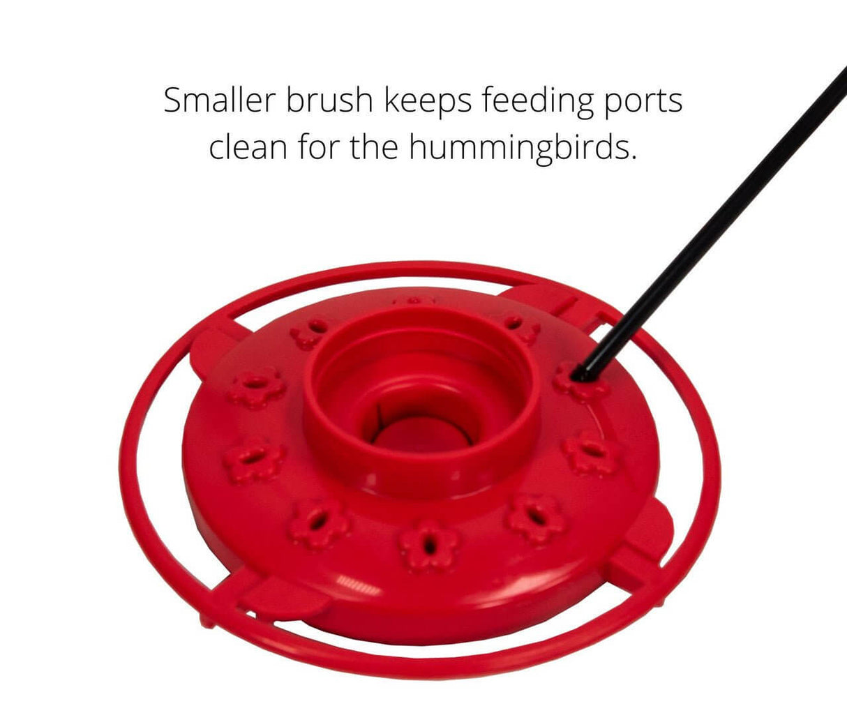 First Nature 3055 feeder showing cleaning brush for flower-shaped feeding ports, ensuring clean access for hummingbirds.