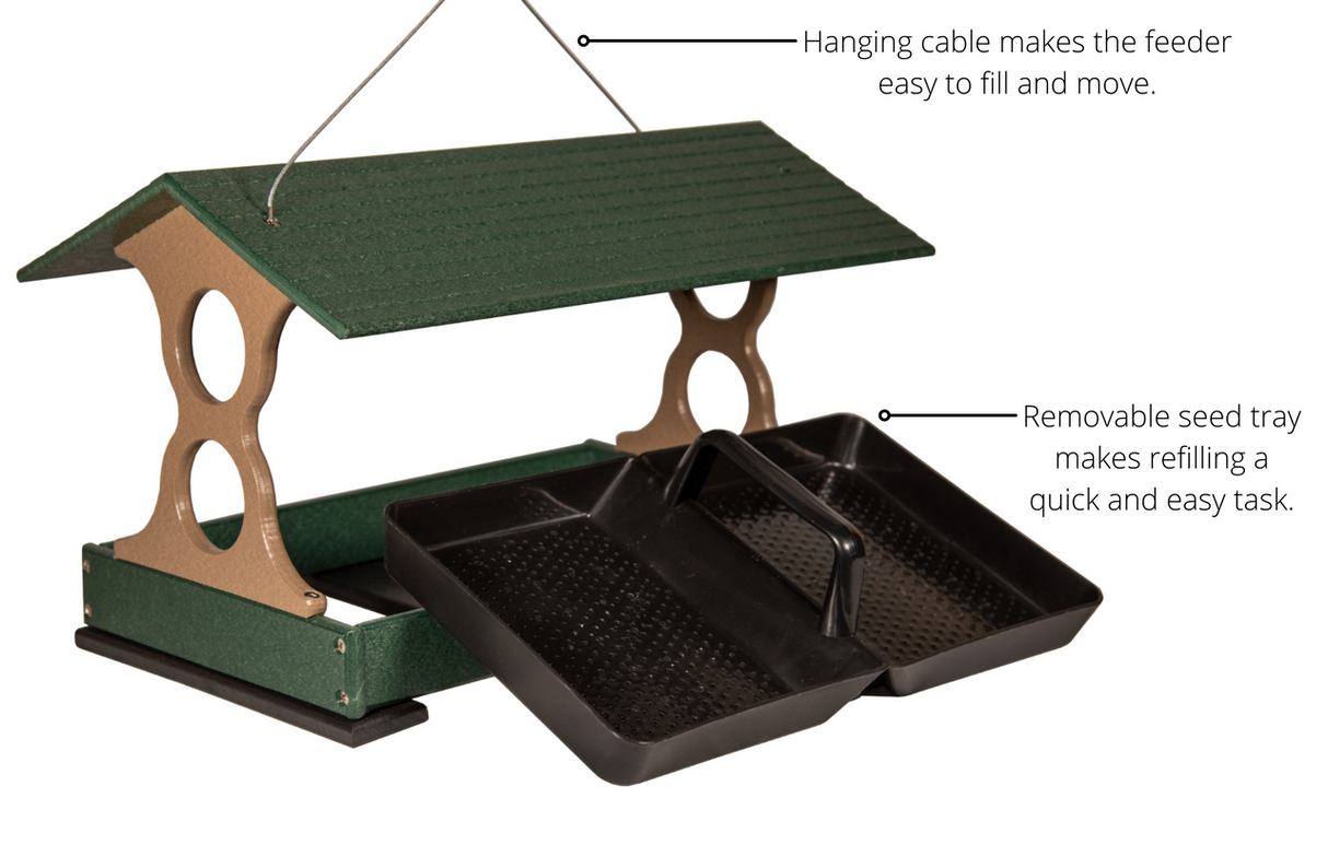Product shot of a green and tan plastic bird feeder with removable trays a hanging cable and a sloped roof