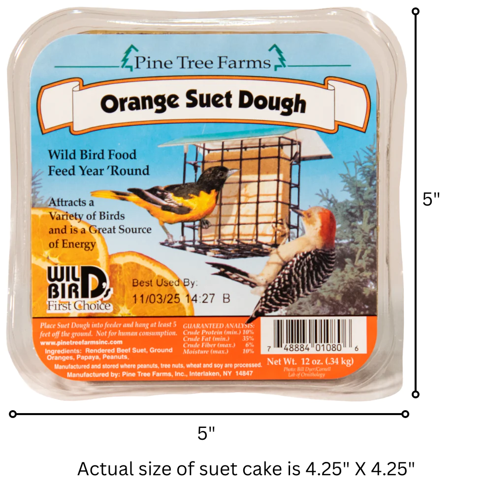 Pine Tree Farms product label featuring an orange suet dough cake for wild birds, showing a Baltimore Oriole and a Red-bellied Woodpecker at a bird feeder against a vibrant orange and green background with detailed nutritional information