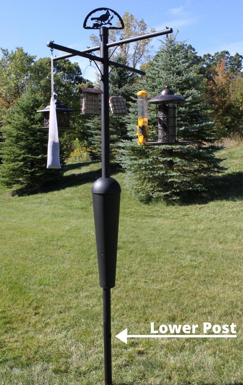 Lower post segment for Squirrel Stopper bird feeder post assembly in a garden setting.