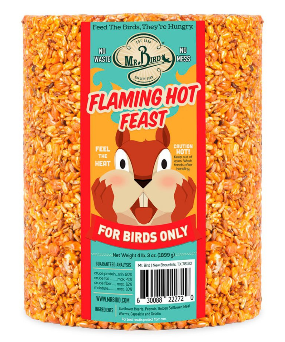 Mr Bird's Flaming Hot Feast bird food cylindrical package shows a cartoon squirrel New Braunfels Texas featuring vibrant orange seeds and a cautionary label