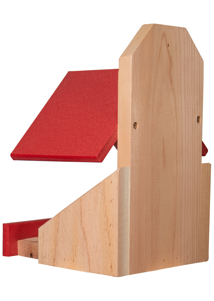 Wooden birdhouse with a bright red roof and small landing platform featuring a simple gabled design and visible wood grain showcasing natural light colored wood