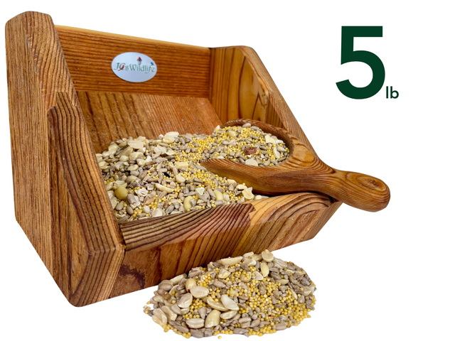 JQs Wildlife wooden bird feeder filled with five pounds of birdseed containing sunflower seeds peanuts and millet in a rustic wooden scoop and tray.