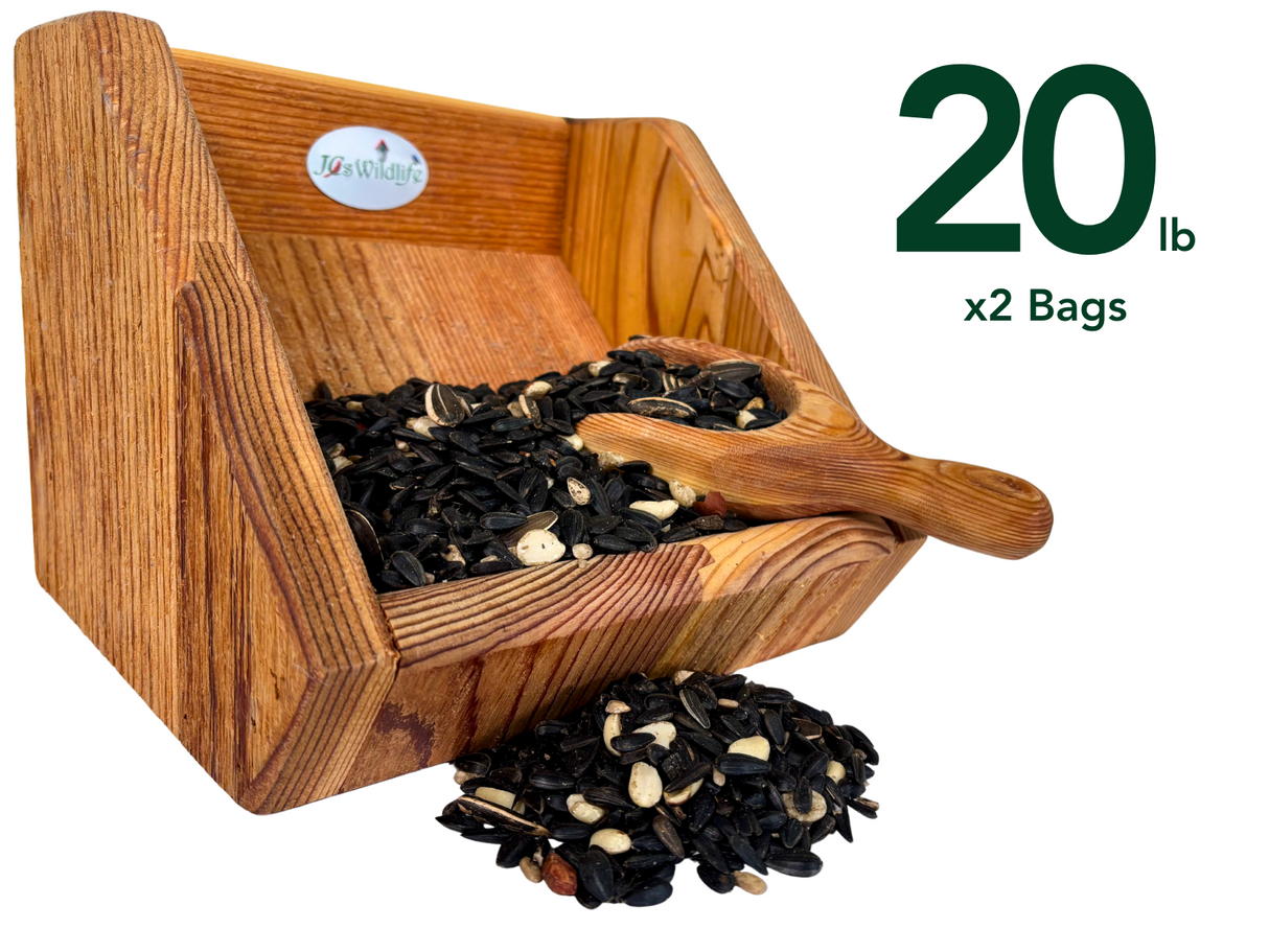 JGs Wildlife wooden bird feeder filled with black oil sunflower seeds peanuts and white striped seeds a scoop rests inside  a rich brown wooden grain is visible throughout