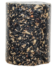 Close-up of a cylindrical birdseed cake containing black oil sunflower seeds, peanuts, and striped sunflower seeds