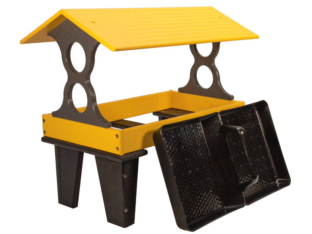 Plastic recycled bird feeder with yellow roof and black base featuring two removable trays and decorative cutouts