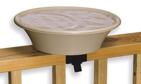 Heated bird bath mounted on deck railing with EZ Tilt Mounting and Stand, providing ice-free water for birds in winter.