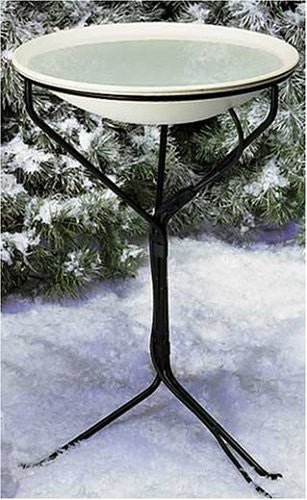 Allied Precision Heated Bird Bath with Metal Stand in a snowy backyard, providing ice-free water for birds all winter.