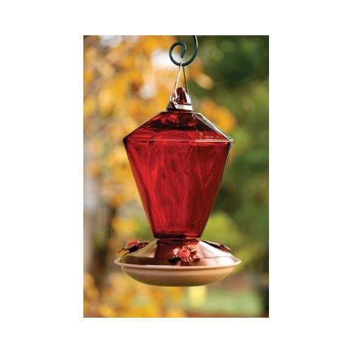 Copper color hummingbird feeder with ruby diamond glass and 24oz nectar capacity, featuring 3 feeding stations, hanging outdoors.