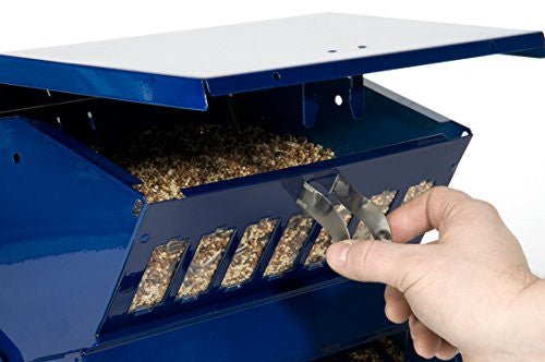 Hand filling the Electric Blue Woodlink Absolute II Squirrel Resistant Bird Feeder Model 7537 with bird seed