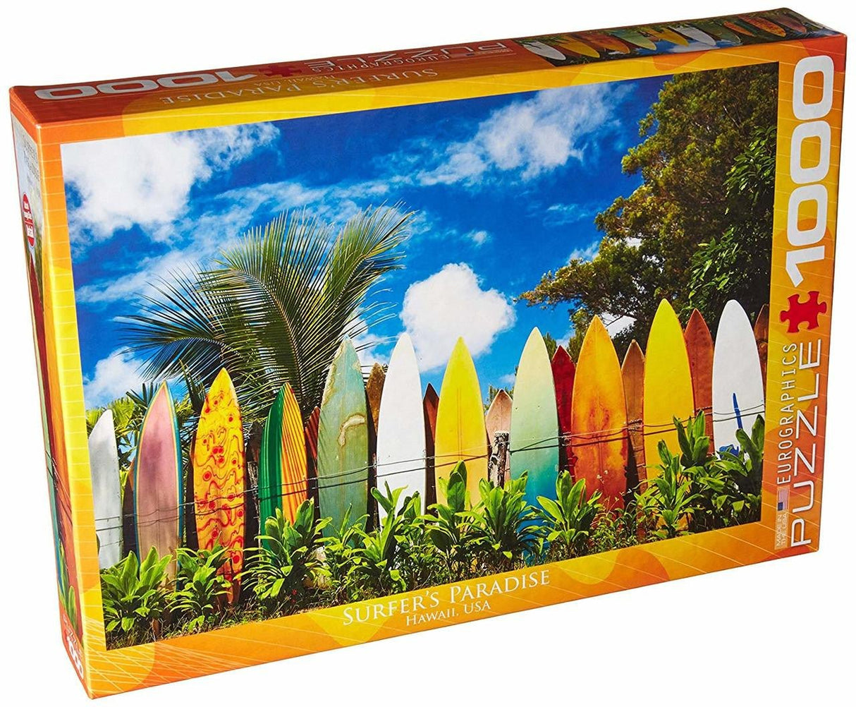 Box of EuroGraphics Surfer's Paradise Hawaii 1000-piece jigsaw puzzle showing colorful surfboards and blue sky