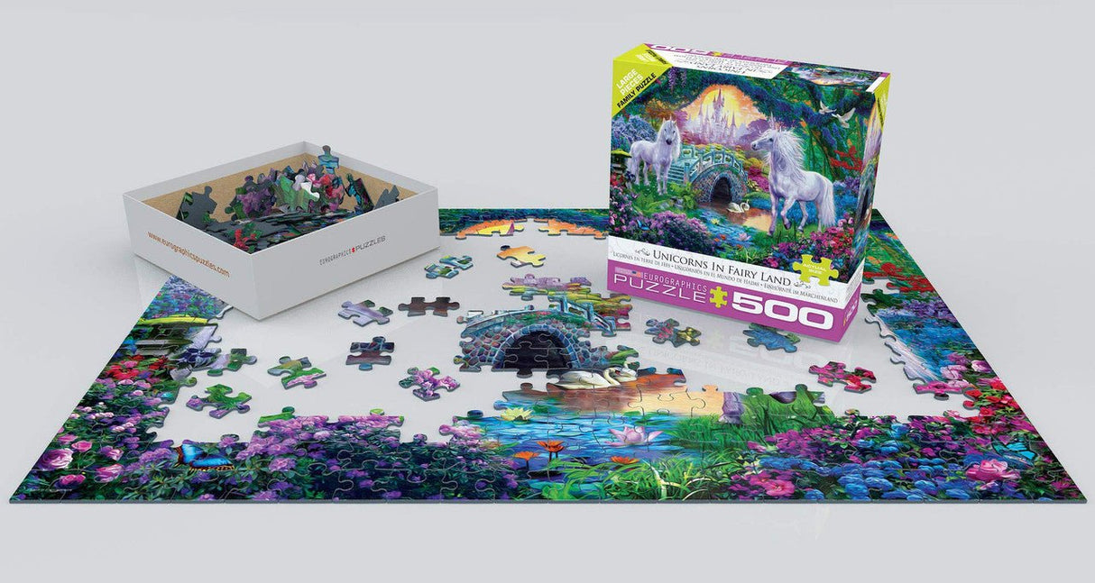 EuroGraphics Unicorn Fairy Land 500-piece jigsaw puzzle partially completed with box and pieces scattered on table