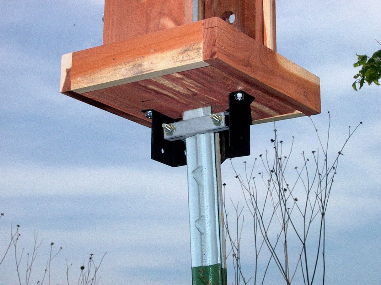 Heritage Farms Universal Mounting Bracket 7503 attached to bird feeder mounted on 4x4 post and 2-inch diameter pole
