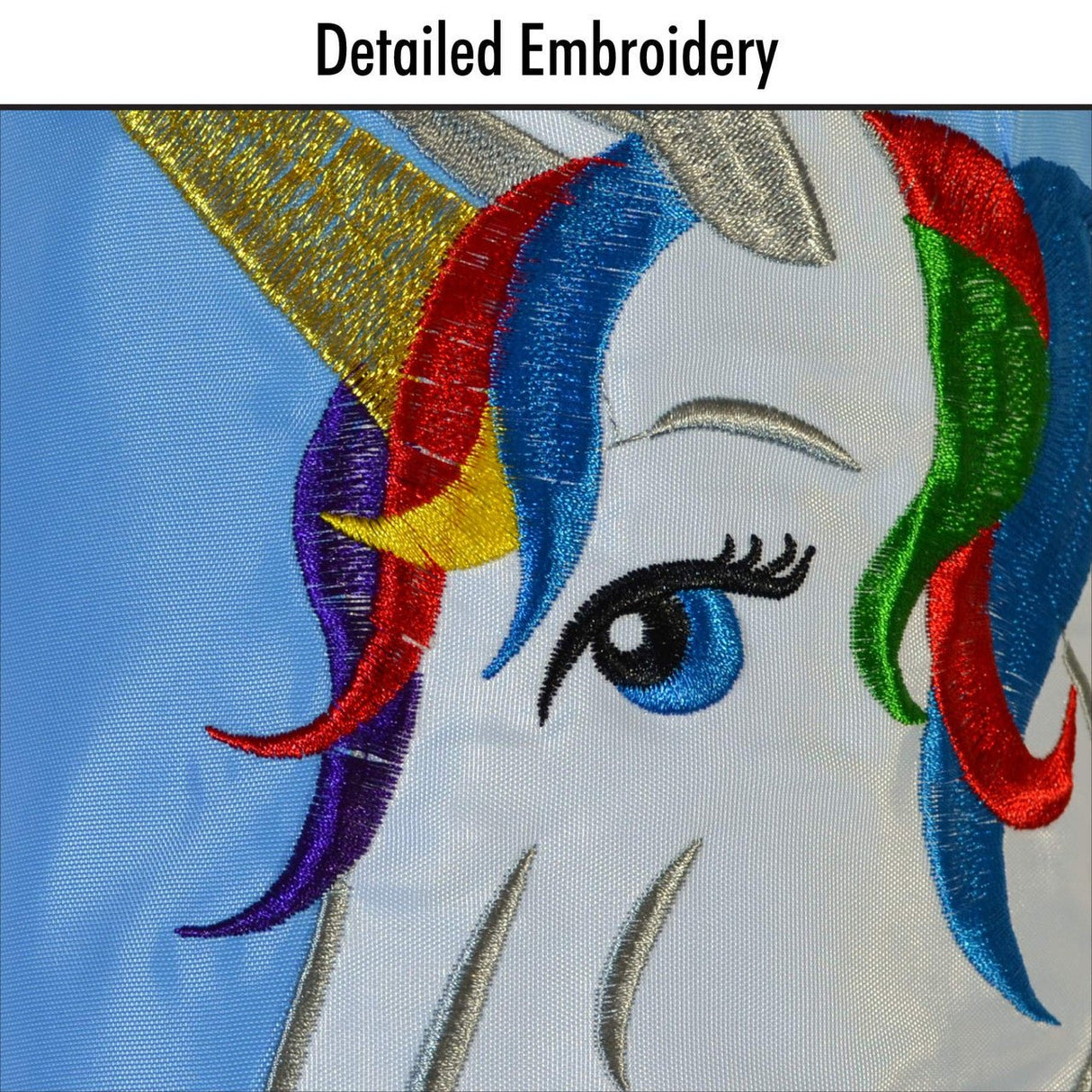 Close-up of the In The Breeze Unicorn Windsock with detailed appliqued graphics and embroidered accents featuring a unicorn's face.