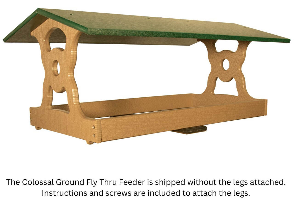 JCS Wildlife Colossal Ground Fly Thru Feeder with green roof, designed for easy assembly, holds 16 cups of bird seed.
