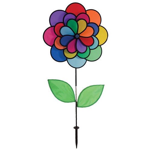 In The Breeze 24-Petal Flower Triple Wheel Spinner with Leaves in vibrant rainbow colors for garden decoration.