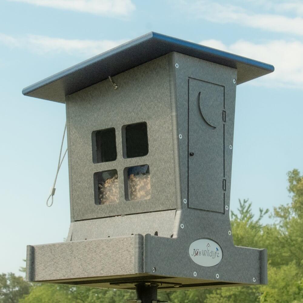 JCS Wildlife Large Poly Outhouse Feeder featuring Petey the Pooper, ideal for bird feeding with a durable design.