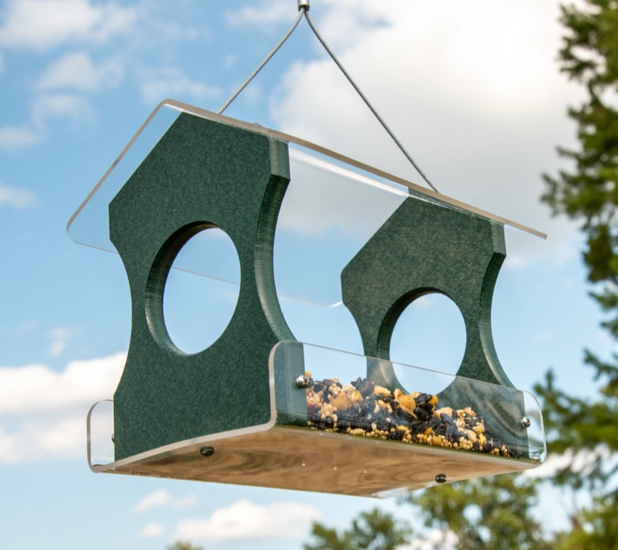 JCS Wildlife Recycled Poly Lumber Hanging Bird Feeder filled with seeds, featuring vibrant design attracting cardinals, bluebirds, and more birds.