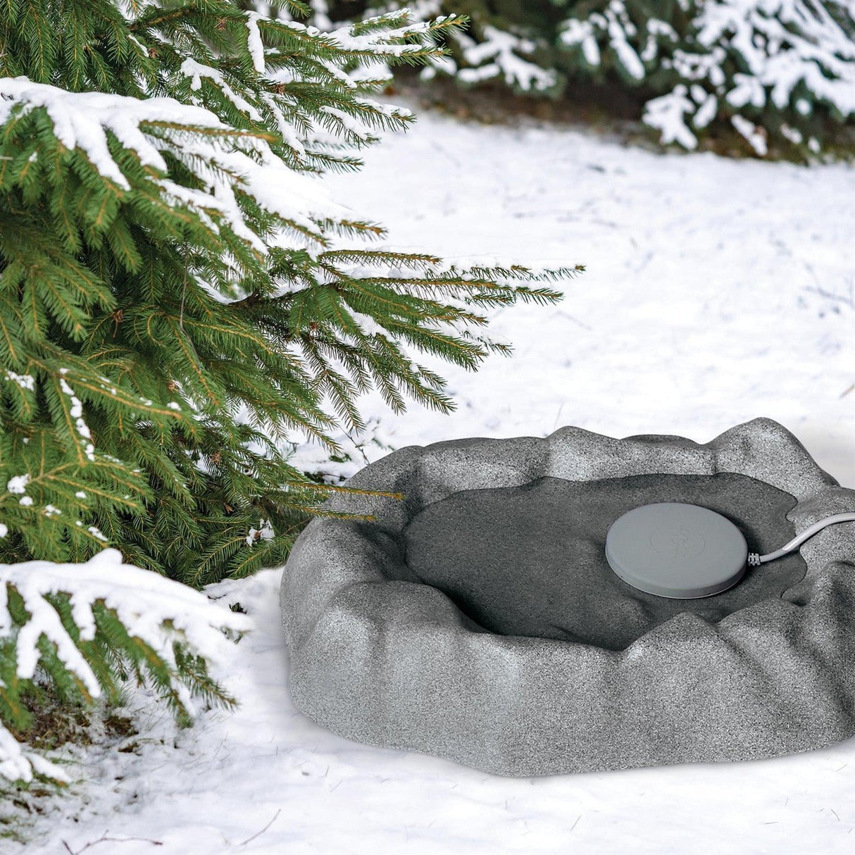 K&H Heated Plastic Thermo-Birdbath 9006 in a snowy backyard, ready to keep water ice-free for birds.