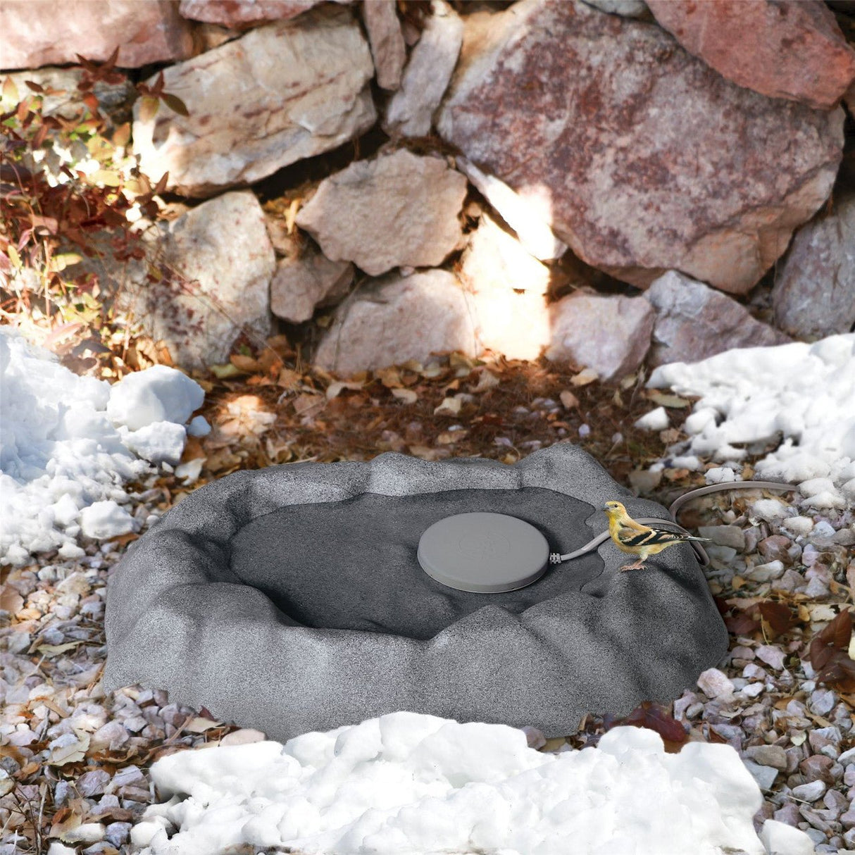 K&H Heated Plastic Thermo-Birdbath 9006 in winter setting for attracting birds with ice-free water.