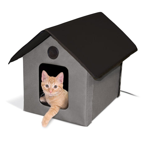 Orange cat in K&H Pet Products Outdoor Thermo Kitty House with heated model for added warmth and comfort in barns, garages, and porches