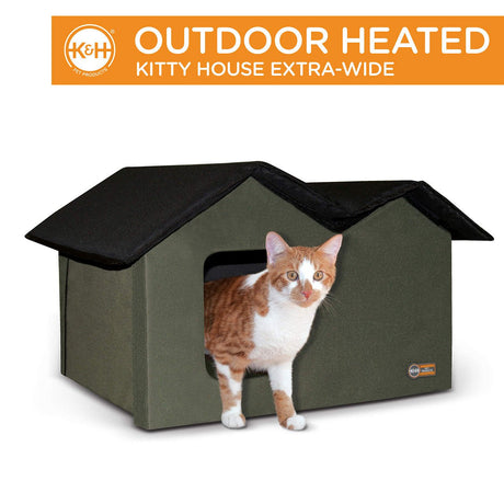 Outdoor Heated Kitty House Extra-Wide in olive/black color with a cat inside for warmth and protection by K&H.