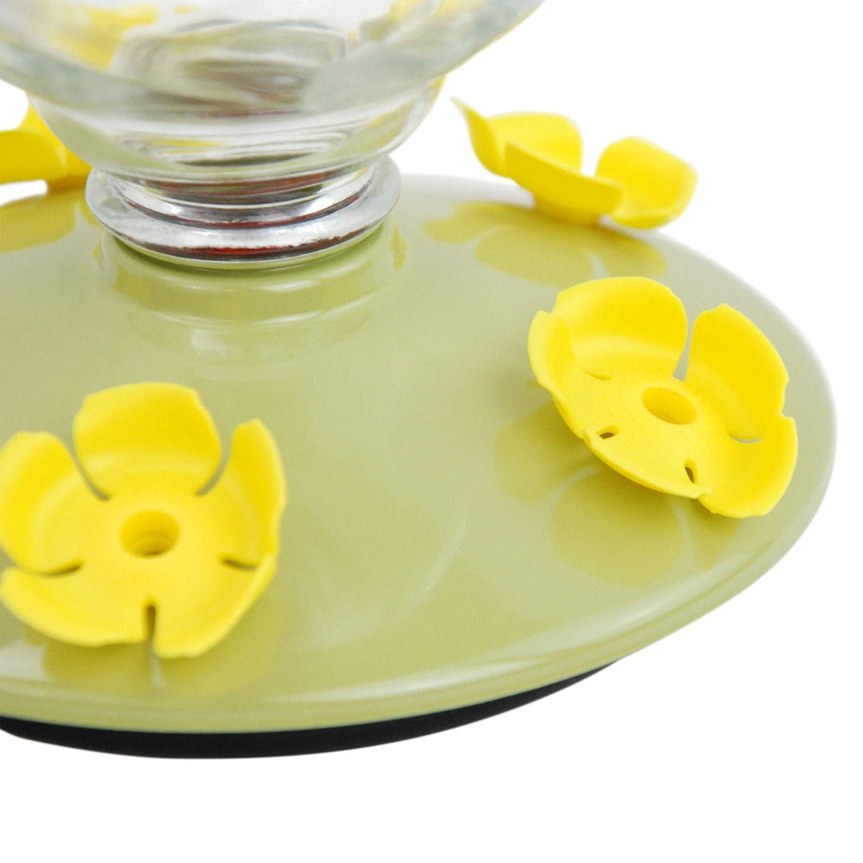 Close-up of the yellow flower feeding ports on the Perky-Pet Desert Bloom Top-Fill Glass Hummingbird Feeder.