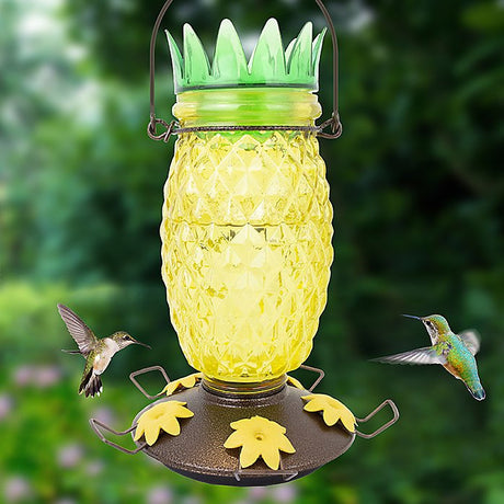 Perky-Pet Pineapple Top-Fill Hummingbird Feeder with two hummingbirds feeding, 28 oz capacity, wide-mouth opening, and easy Top-Fill design.