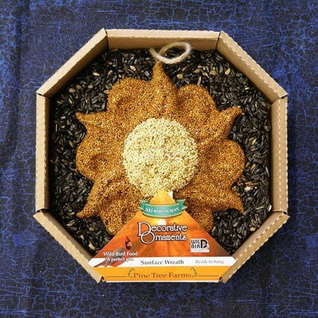 Pine Tree Farms Sun Face Seed Wreath for birds, decorative celestial design, made with black oil sunflower, white millet, and red millet.