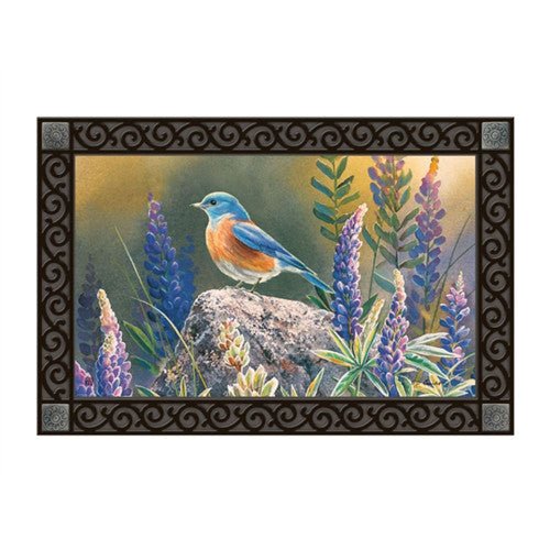 Studio M Flower Watching MatMate Doormat with bluebird on rock surrounded by purple flowers, made of recycled rubber and durable polyester.